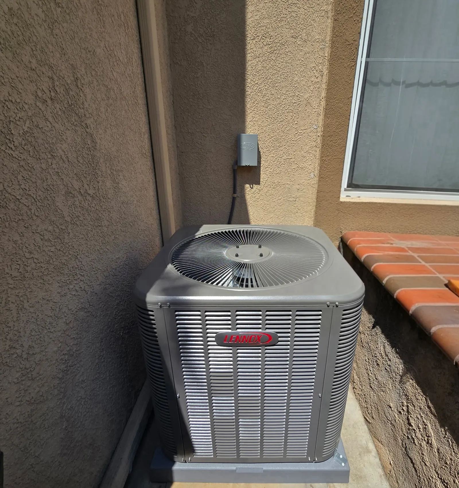 AC repair work on a residential outdoor condenser unit